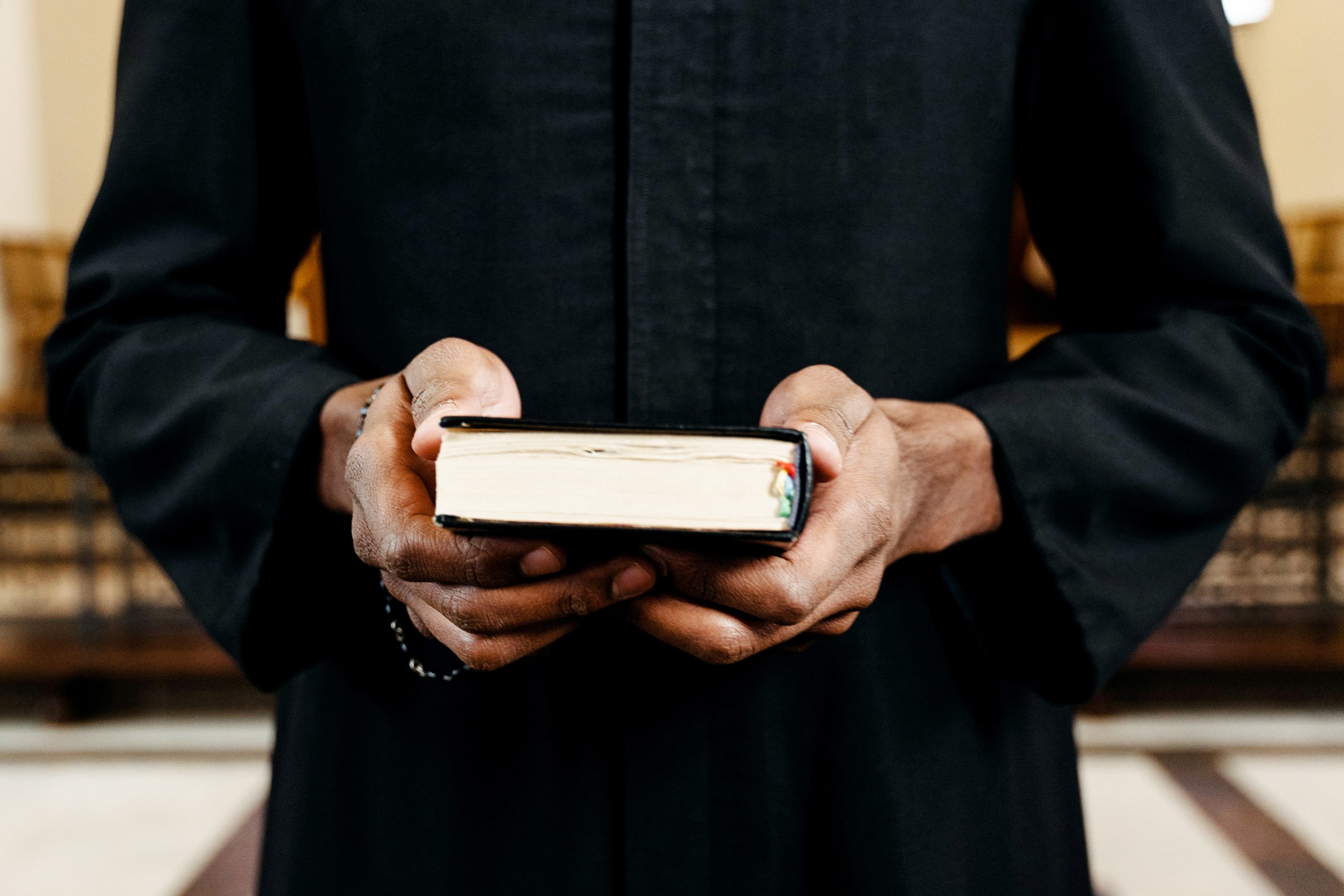 A Person Holding a Bible