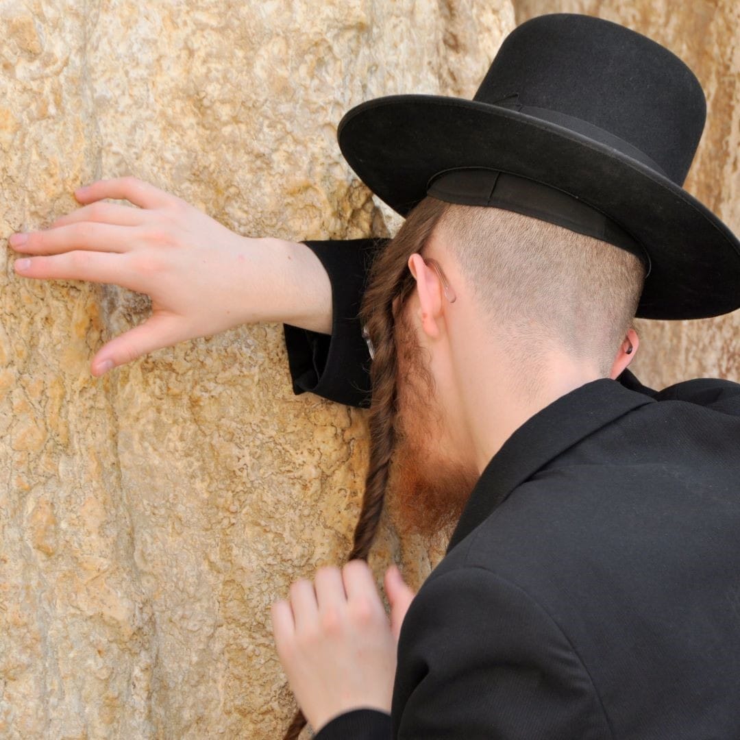 Jewish man praying at western wall