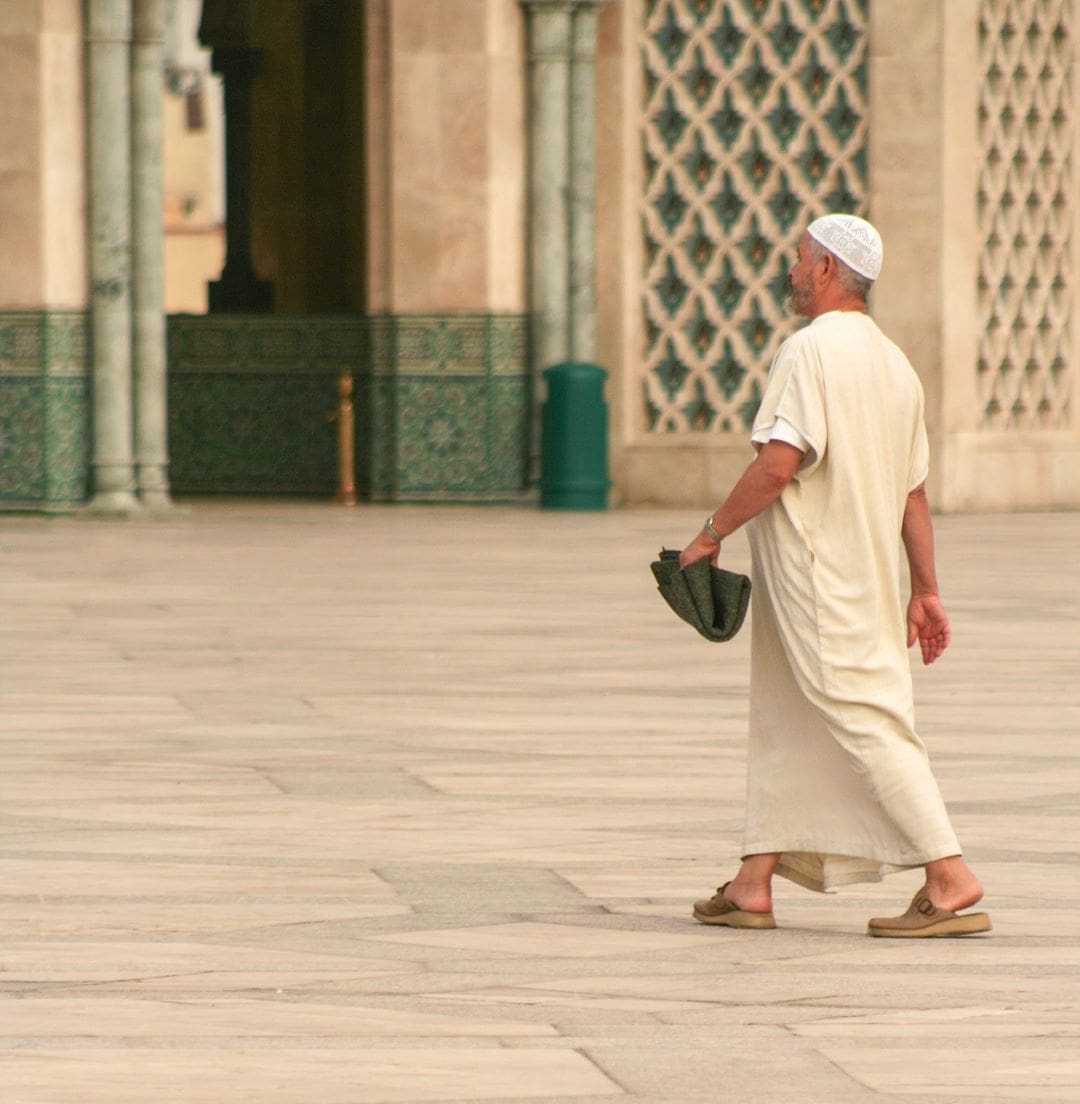 Man in Morocco Walking Through Square